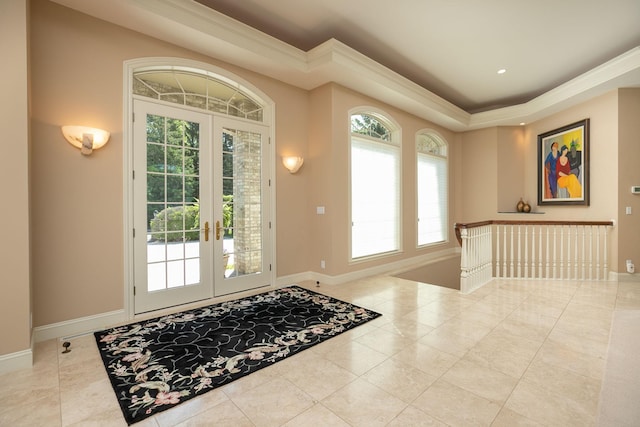 foyer with light tile patterned floors and french doors