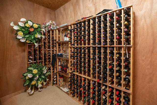 wine cellar with wood walls and carpet floors