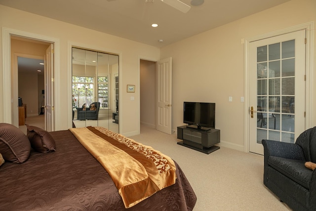 bedroom featuring ceiling fan and light colored carpet