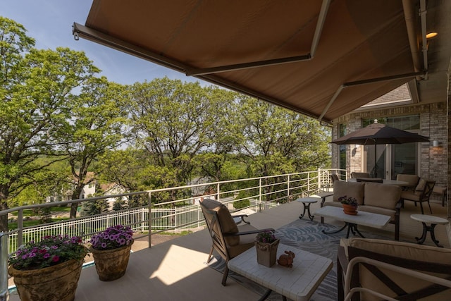 view of patio / terrace featuring an outdoor living space and a balcony