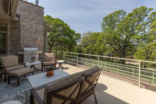 view of patio / terrace featuring outdoor lounge area, a balcony, and a grill