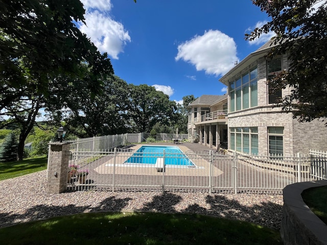 view of swimming pool with a patio area