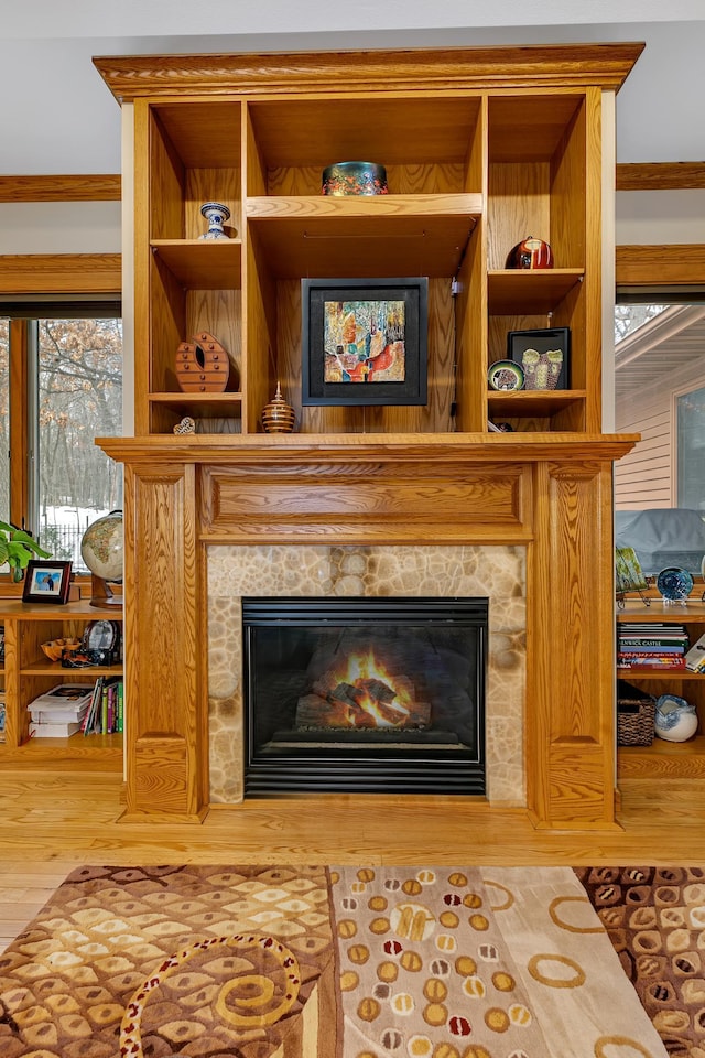 details with hardwood / wood-style flooring and crown molding