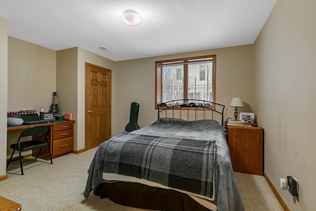 bedroom featuring light colored carpet