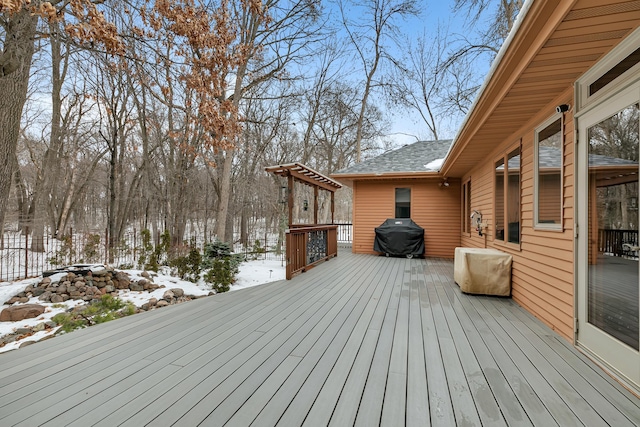 snow covered deck with area for grilling