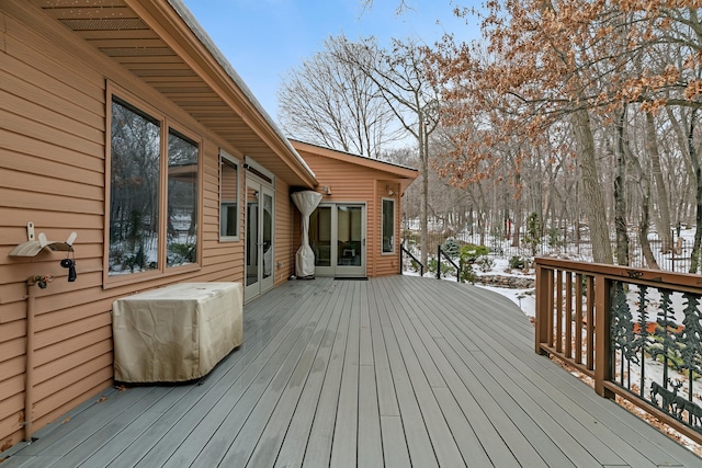 view of snow covered deck