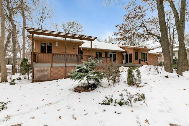 snow covered house featuring covered porch