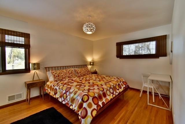 bedroom with hardwood / wood-style floors