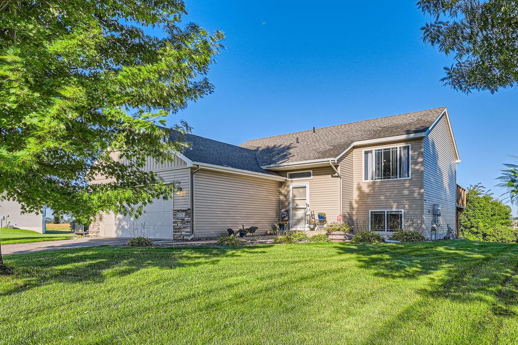 view of front of property with a front lawn and a garage