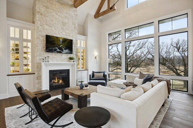 935 Lakewood Hills Rd, Eagan, MN 55123 - living area with a fireplace, high vaulted ceiling, dark wood-style floors, and beamed ceiling