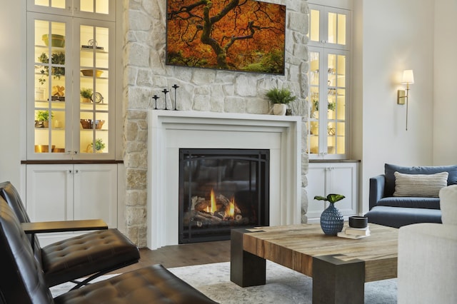 935 Lakewood Hills Rd, Eagan, MN 55123 - sitting room with a stone fireplace and wood finished floors