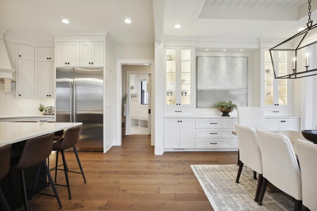 935 Lakewood Hills Rd, Eagan, MN 55123 - dining area featuring wood-type flooring, recessed lighting, and a chandelier