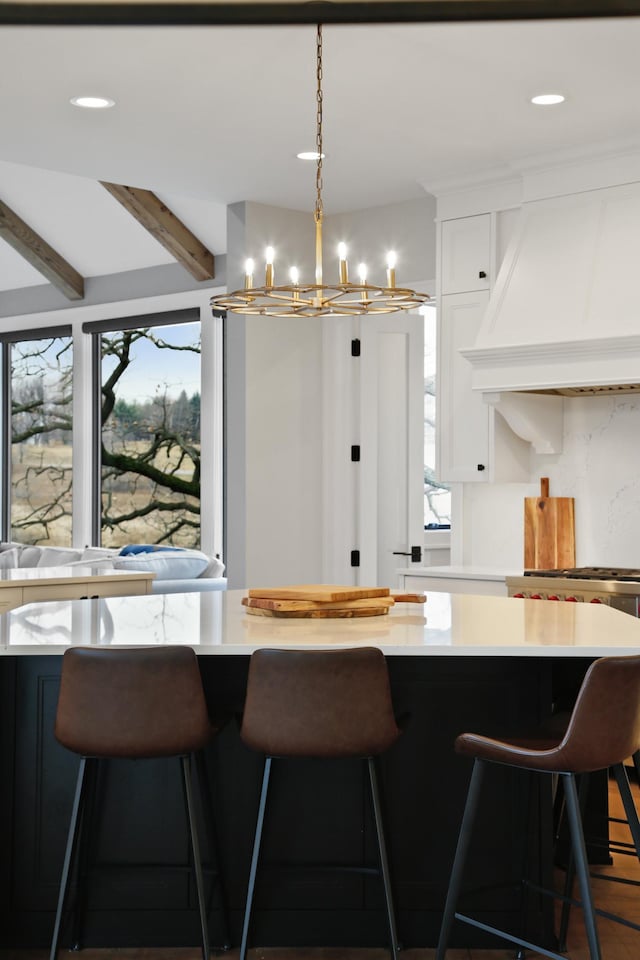 935 Lakewood Hills Rd, Eagan, MN 55123 - kitchen with custom range hood, plenty of natural light, white cabinets, a chandelier, and beamed ceiling