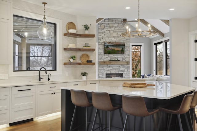 935 Lakewood Hills Rd, Eagan, MN 55123 - kitchen with a sink, decorative backsplash, light countertops, and recessed lighting