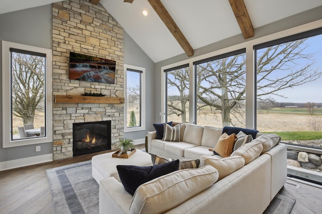 935 Lakewood Hills Rd, Eagan, MN 55123 - living area featuring beamed ceiling, a fireplace, wood-type flooring, baseboards, and high vaulted ceiling