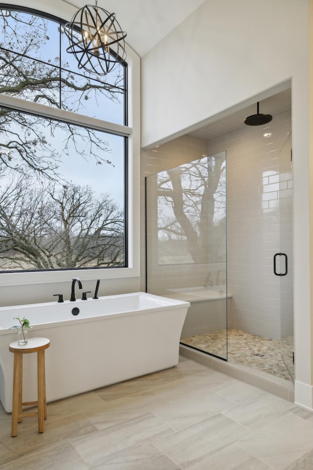 935 Lakewood Hills Rd, Eagan, MN 55123 - bathroom featuring a shower stall, healthy amount of natural light, and a freestanding bath