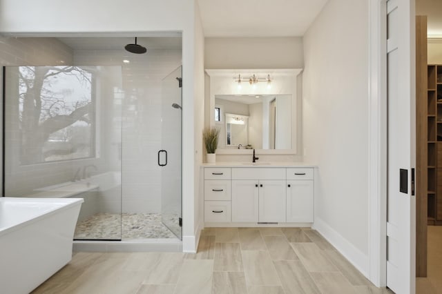 935 Lakewood Hills Rd, Eagan, MN 55123 - full bath featuring a stall shower, baseboards, vanity, a freestanding bath, and a spacious closet