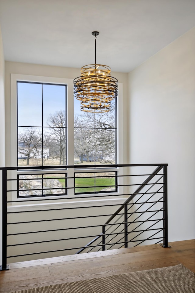 935 Lakewood Hills Rd, Eagan, MN 55123 - staircase featuring a chandelier, wood finished floors, and healthy amount of natural light