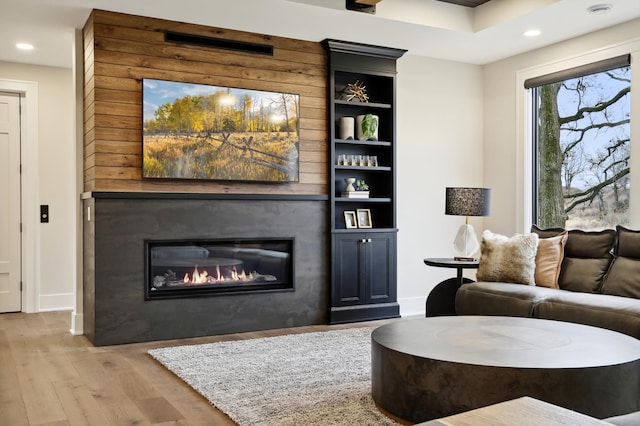 935 Lakewood Hills Rd, Eagan, MN 55123 - living area featuring wood finished floors, recessed lighting, a large fireplace, and baseboards