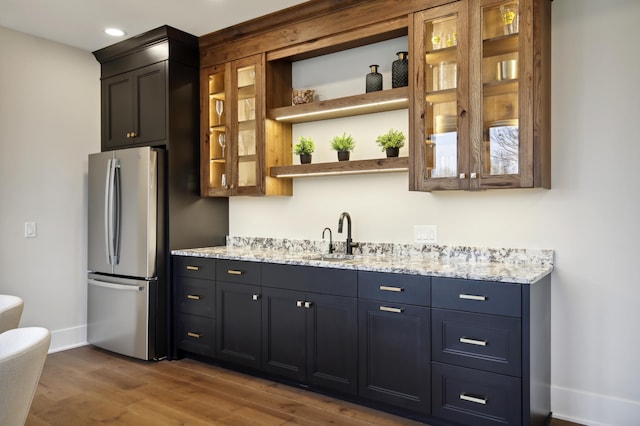 935 Lakewood Hills Rd, Eagan, MN 55123 - bar featuring freestanding refrigerator, a sink, wood finished floors, baseboards, and recessed lighting