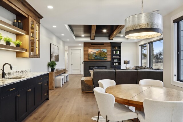 935 Lakewood Hills Rd, Eagan, MN 55123 - dining area featuring light wood-style flooring, recessed lighting, and a large fireplace