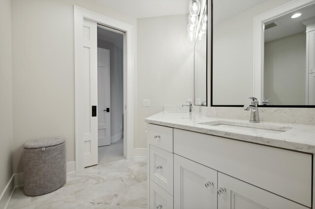 935 Lakewood Hills Rd, Eagan, MN 55123 - full bathroom featuring baseboards, marble finish floors, double vanity, and recessed lighting