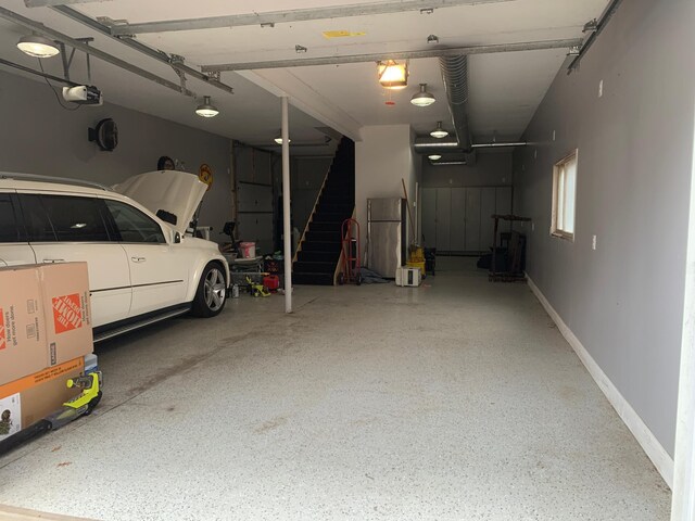 935 Lakewood Hills Rd, Eagan, MN 55123 - garage with a garage door opener and baseboards