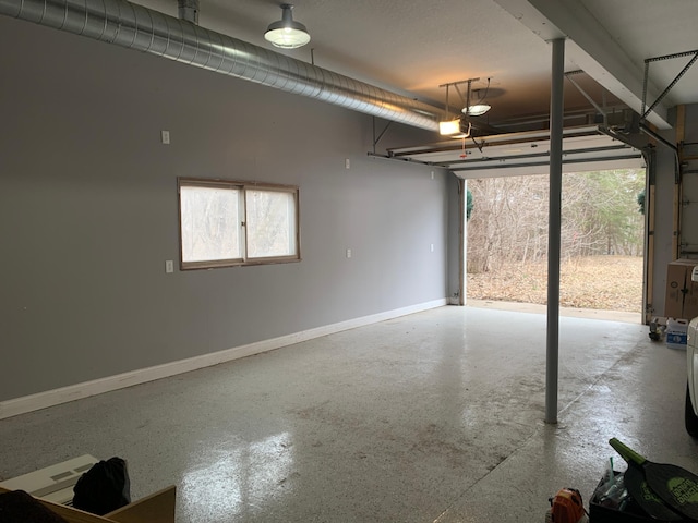 935 Lakewood Hills Rd, Eagan, MN 55123 - garage with a garage door opener and baseboards