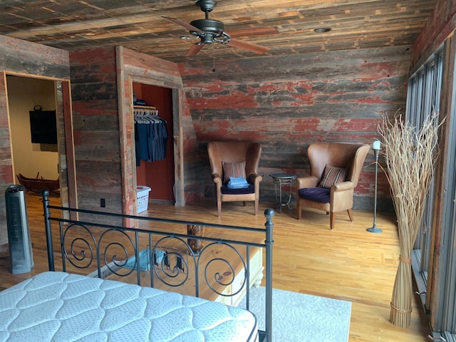 935 Lakewood Hills Rd, Eagan, MN 55123 - bedroom featuring wood finished floors and brick wall