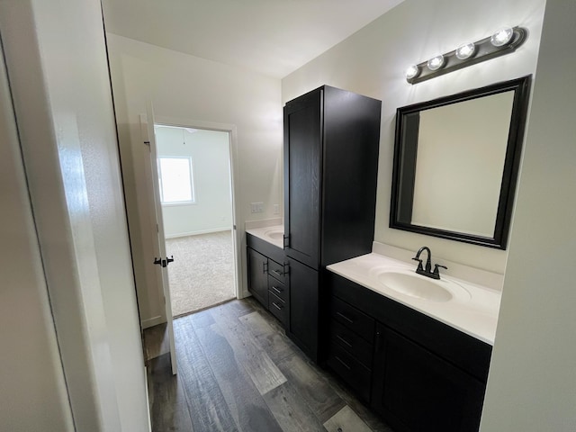 bathroom featuring vanity and wood-type flooring