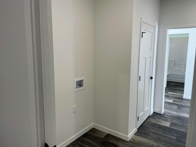 washroom featuring dark wood-type flooring and hookup for a washing machine