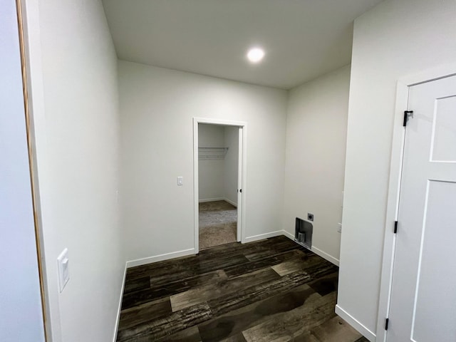 washroom with electric dryer hookup and dark hardwood / wood-style flooring