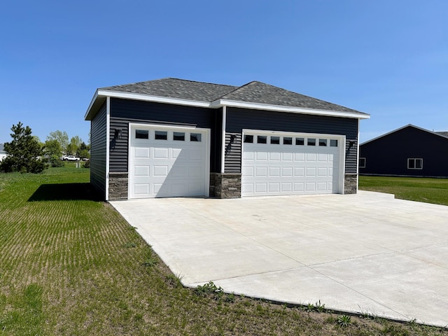 garage featuring a yard