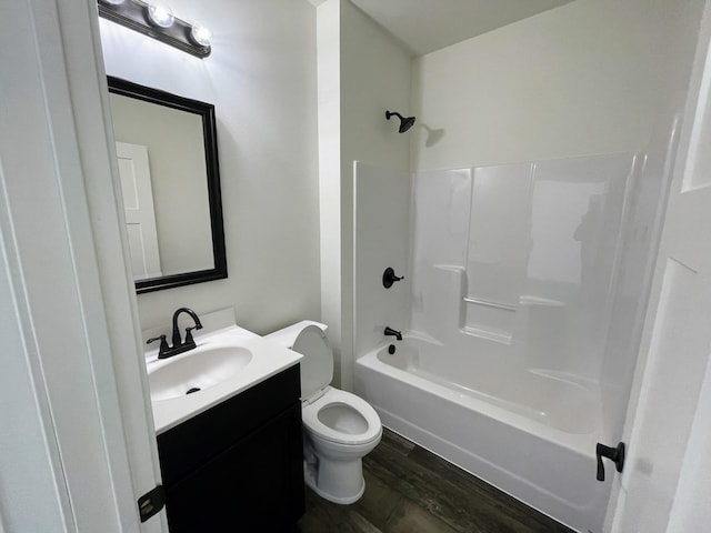 full bathroom featuring shower / bathing tub combination, vanity, toilet, and hardwood / wood-style floors