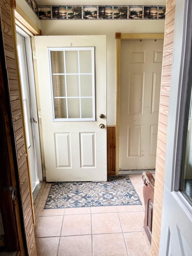 doorway to outside featuring tile patterned floors