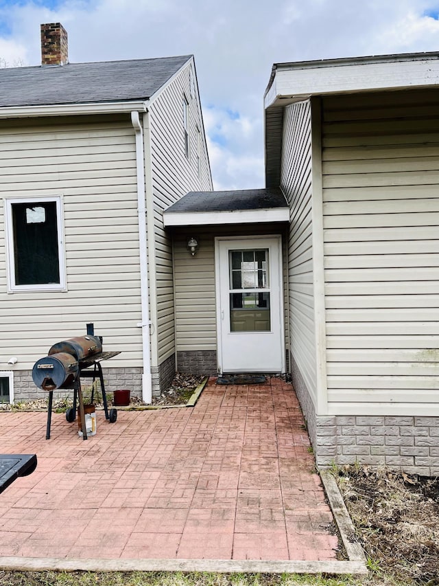 doorway to property with a patio