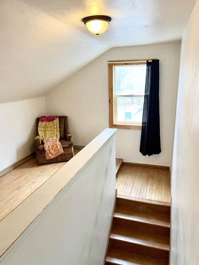 stairs with lofted ceiling