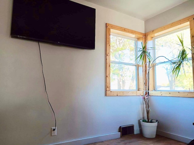 spare room with hardwood / wood-style flooring