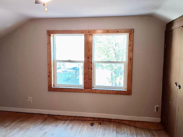 bonus room featuring wood-type flooring and lofted ceiling