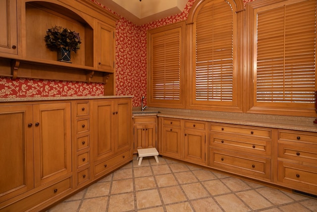 bathroom featuring tile flooring and sink