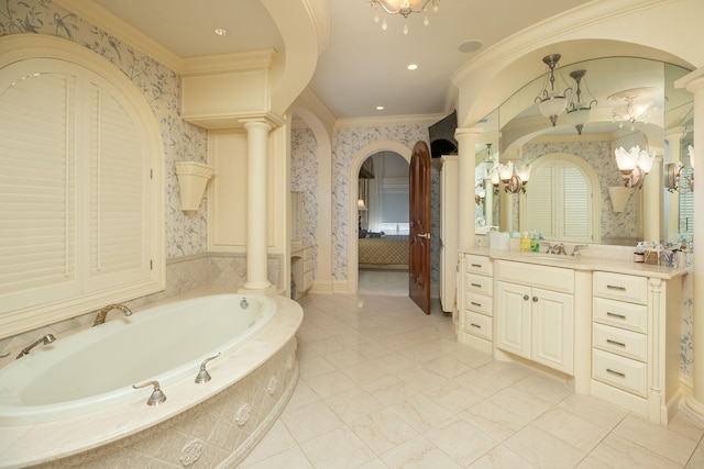 bathroom featuring tiled bath, tile flooring, crown molding, and ornate columns