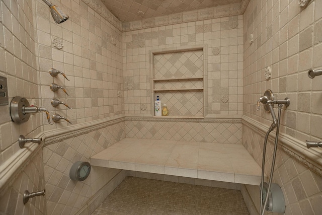 bathroom with tile walls