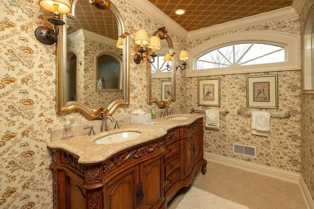 bathroom with a notable chandelier, tile floors, crown molding, and dual vanity