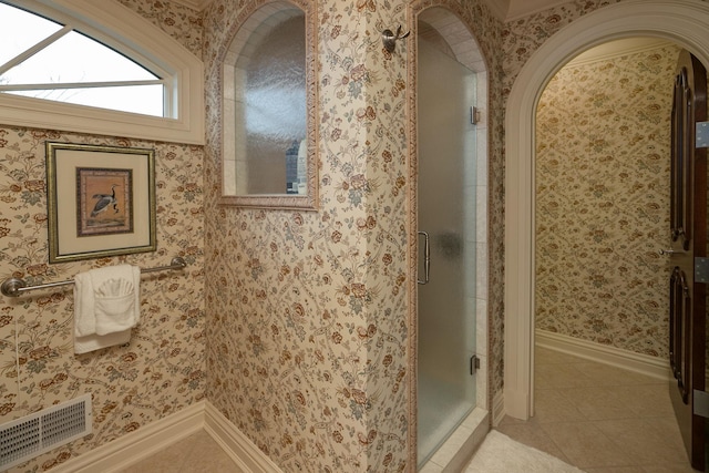 bathroom featuring tile flooring and walk in shower