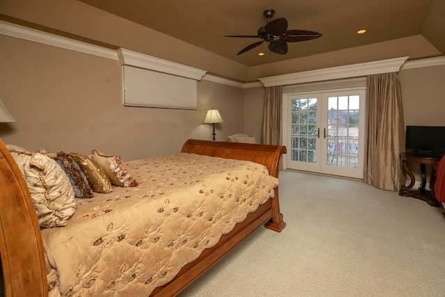 bedroom with light colored carpet, ceiling fan, french doors, a raised ceiling, and access to outside