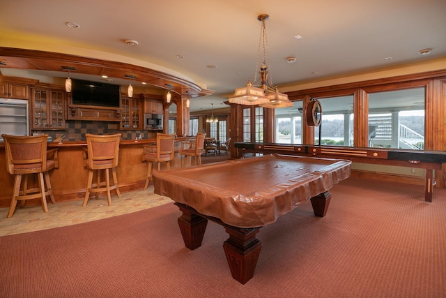 recreation room featuring carpet, pool table, indoor bar, and french doors