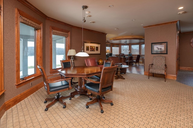 dining space featuring light colored carpet