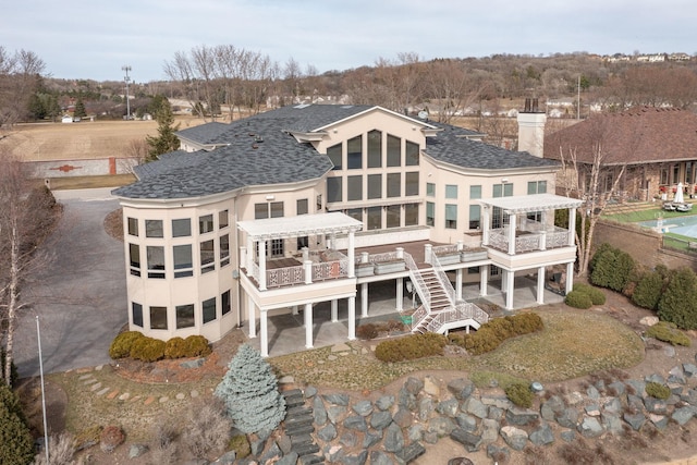 back of house with a wooden deck