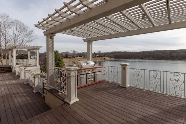 wooden deck featuring a pergola, a water view, and grilling area