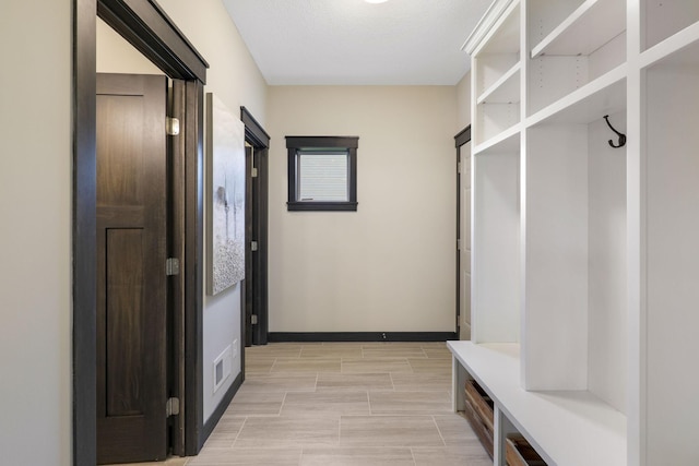 mudroom with light tile floors